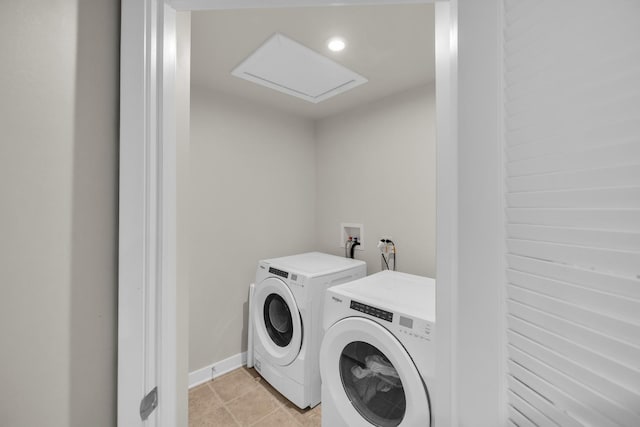 washroom with laundry area, attic access, light tile patterned floors, baseboards, and independent washer and dryer