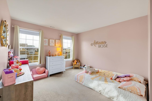 bedroom featuring carpet floors, visible vents, and baseboards