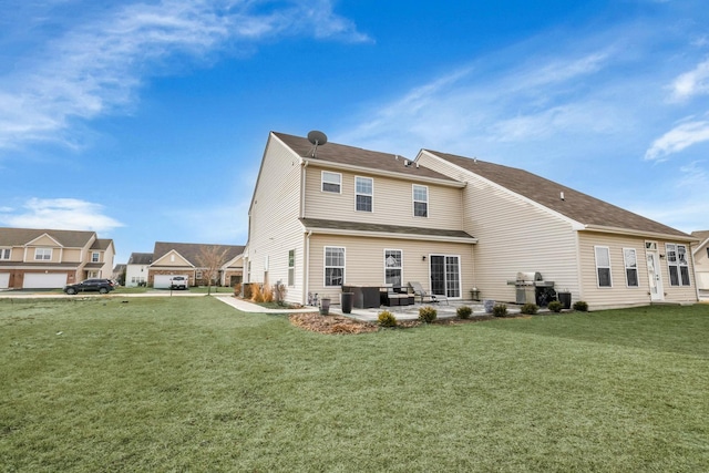 back of house with a patio area and a lawn