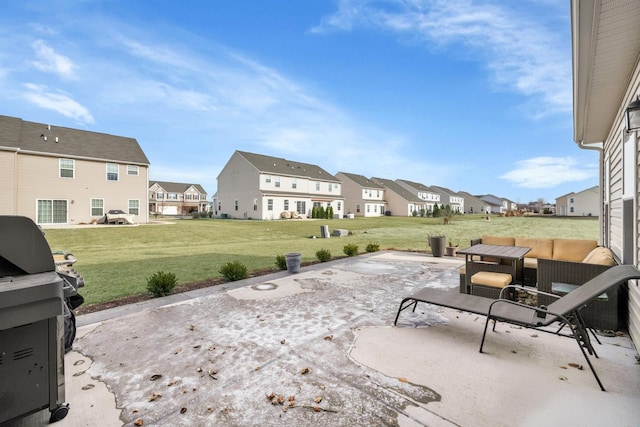 view of patio / terrace with a grill and a residential view