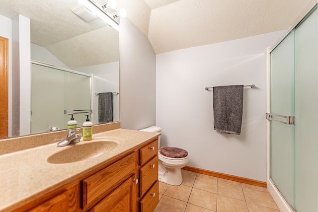 full bathroom with toilet, vanity, a textured ceiling, a shower stall, and tile patterned floors