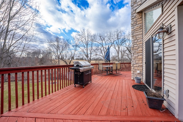 wooden terrace featuring area for grilling