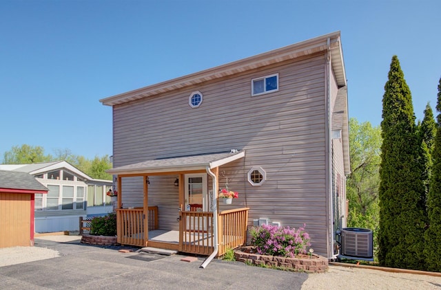 view of front of house featuring cooling unit