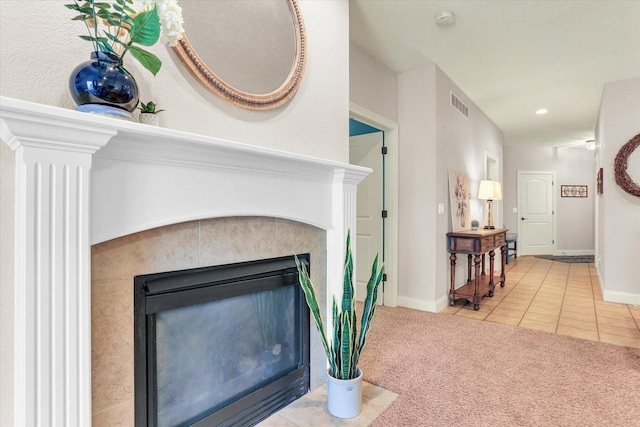 details featuring visible vents, baseboards, carpet flooring, recessed lighting, and a tile fireplace