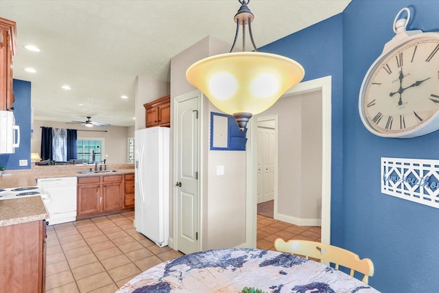 bedroom with white refrigerator with ice dispenser, light tile patterned flooring, recessed lighting, and a sink