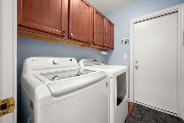 laundry area featuring cabinet space and separate washer and dryer