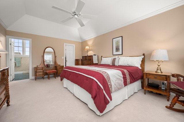 bedroom with crown molding, ceiling fan, lofted ceiling, light carpet, and ensuite bath