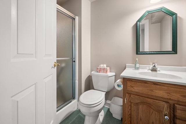 bathroom with vanity, toilet, and a stall shower