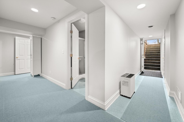 hall featuring visible vents, recessed lighting, stairway, baseboards, and light colored carpet