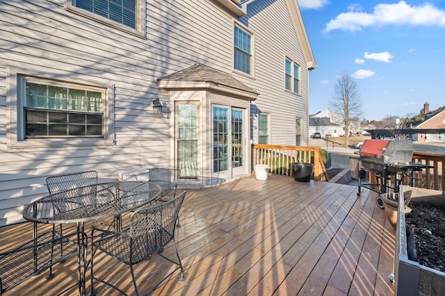 wooden deck featuring outdoor dining space