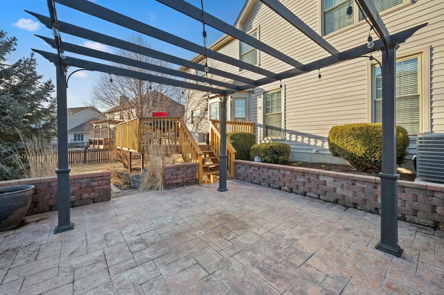 view of patio / terrace with fence, central AC, and a pergola