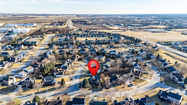 birds eye view of property with a residential view