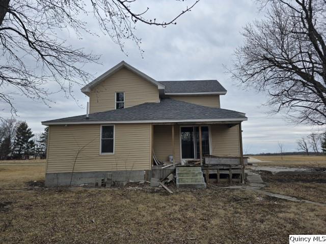 rear view of property with a porch