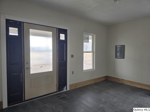 entrance foyer with visible vents, wood finished floors, electric panel, and baseboards