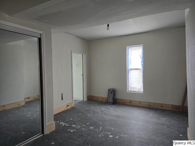 unfurnished bedroom featuring baseboards