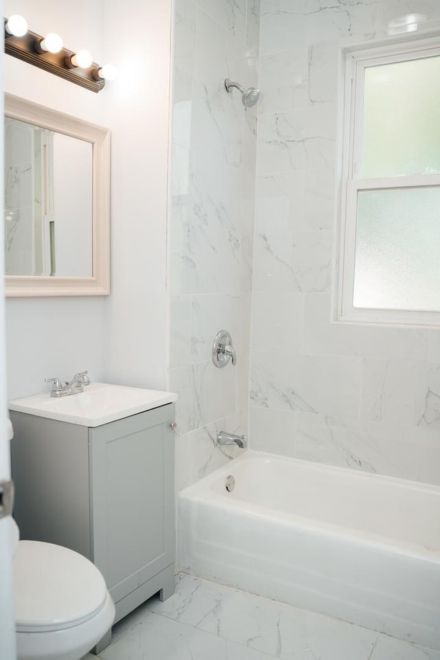 full bathroom with shower / washtub combination, marble finish floor, vanity, and toilet