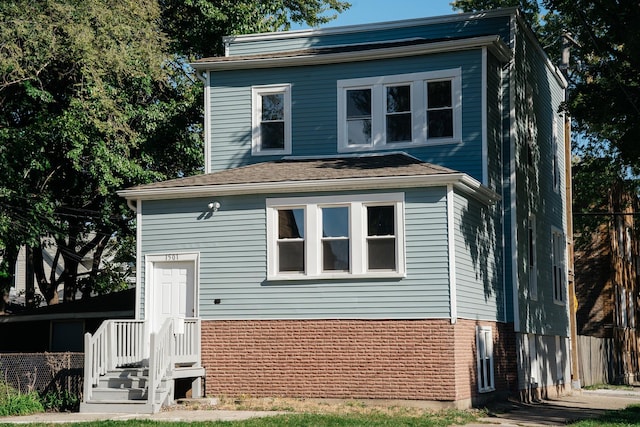 view of front of house with brick siding