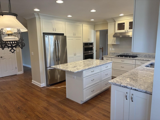 kitchen with dark wood finished floors, a center island, stainless steel appliances, under cabinet range hood, and white cabinetry