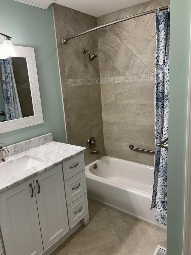 bathroom with shower / bath combination with curtain and vanity