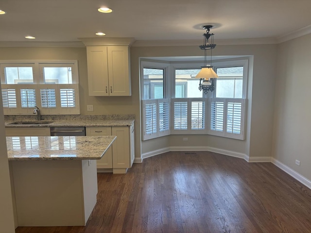 kitchen with crown molding, a healthy amount of sunlight, a sink, and stainless steel dishwasher