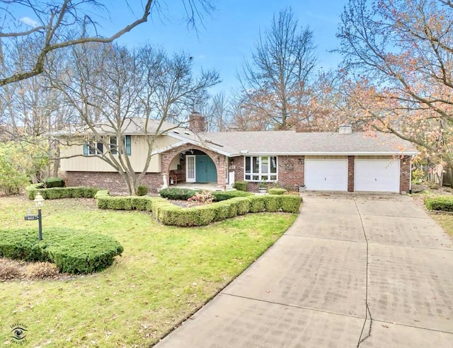 tri-level home featuring brick siding, driveway, and a chimney