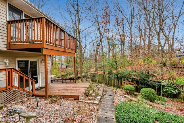 view of yard with a wooden deck and fence