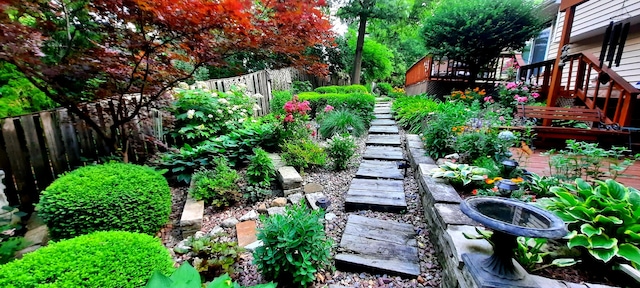 view of yard featuring stairs and fence