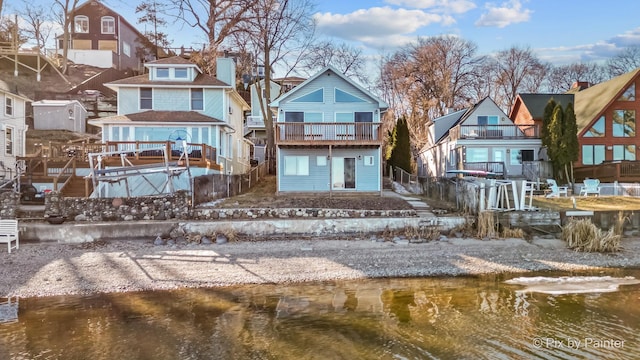 back of house featuring a residential view