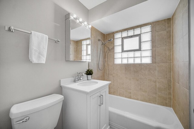 full bath featuring shower / bathing tub combination, vanity, and toilet