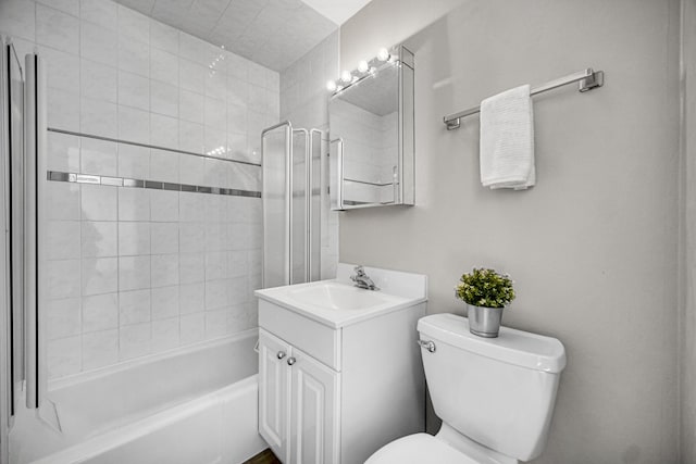 bathroom with shower / bathing tub combination, vanity, and toilet