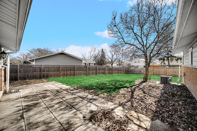 view of yard with a patio area and a fenced backyard