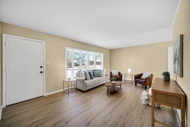 living area featuring wood finished floors and baseboards