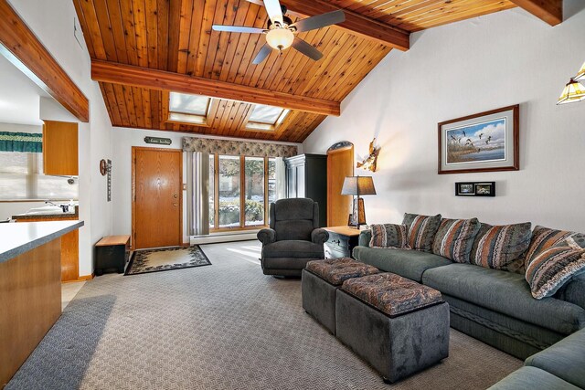 living room with wooden ceiling, lofted ceiling with skylight, baseboard heating, and light colored carpet