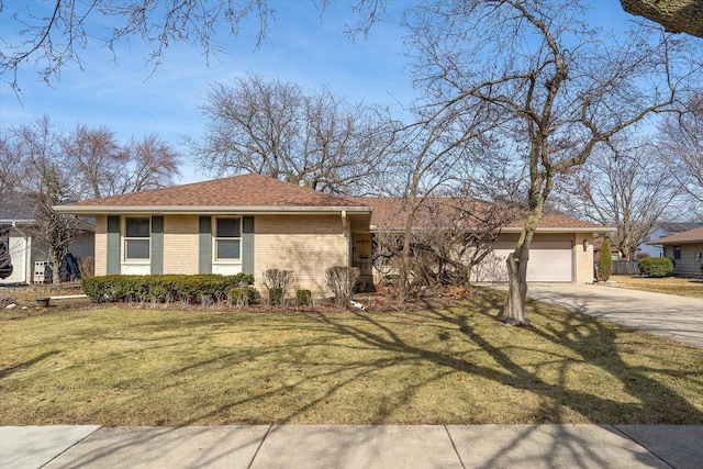 ranch-style home featuring a garage, brick siding, concrete driveway, and a front lawn