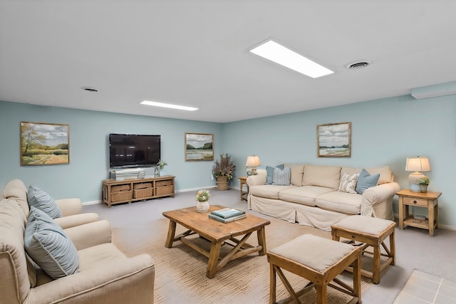 living room featuring visible vents, baseboards, and carpet