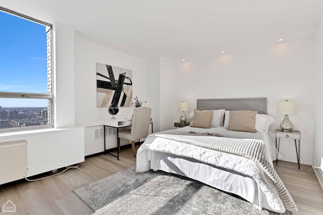 bedroom with wood finished floors