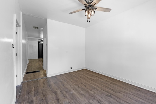 unfurnished room with baseboards, a ceiling fan, and wood finished floors