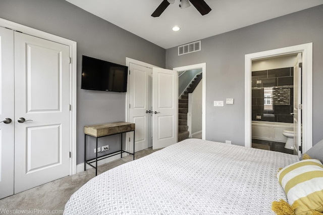 bedroom featuring recessed lighting, carpet flooring, visible vents, baseboards, and ensuite bath