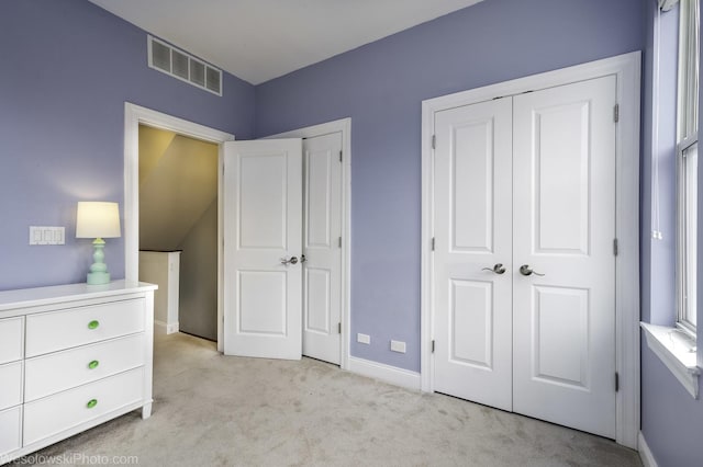 unfurnished bedroom featuring carpet flooring, visible vents, and baseboards