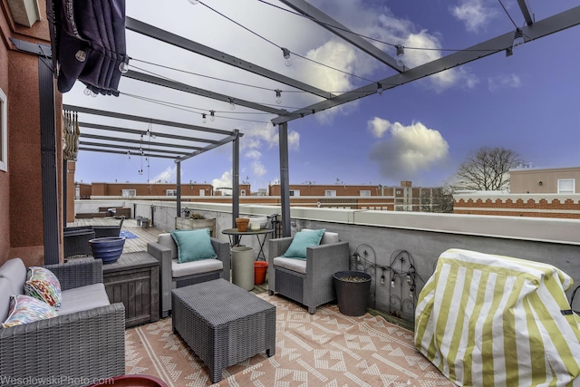 view of patio / terrace featuring an outdoor hangout area and a pergola