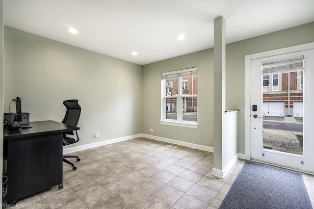 office space featuring light tile patterned floors, baseboards, a wealth of natural light, and recessed lighting