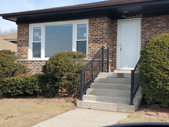 entrance to property with brick siding