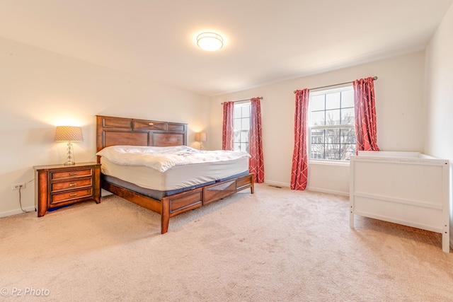 bedroom with carpet flooring and baseboards