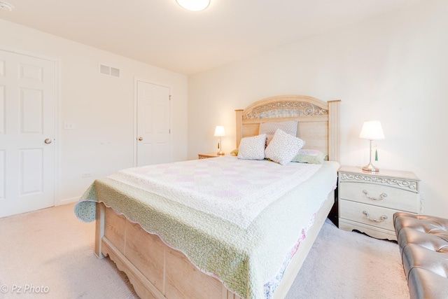 carpeted bedroom with visible vents