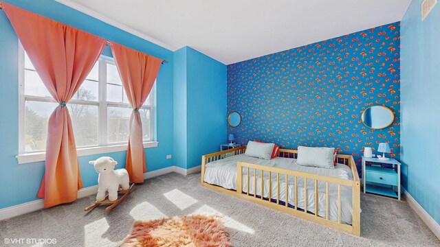 bedroom featuring carpet and baseboards