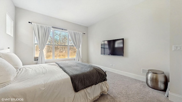 bedroom with visible vents, baseboards, and carpet floors