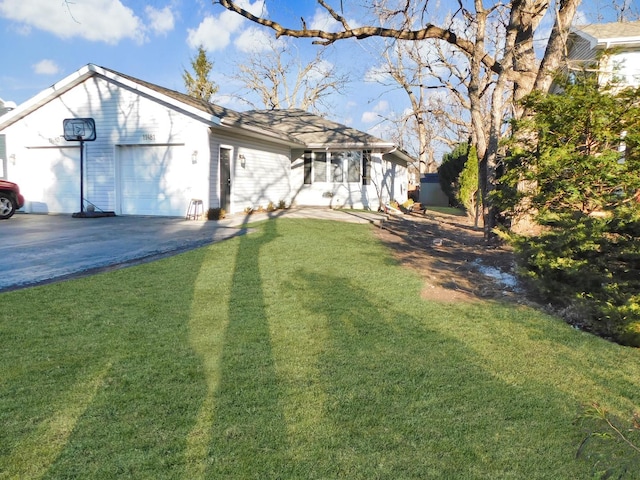 exterior space with an attached garage and aphalt driveway