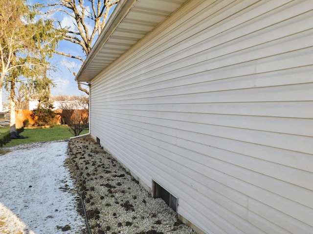 view of side of home featuring a lawn