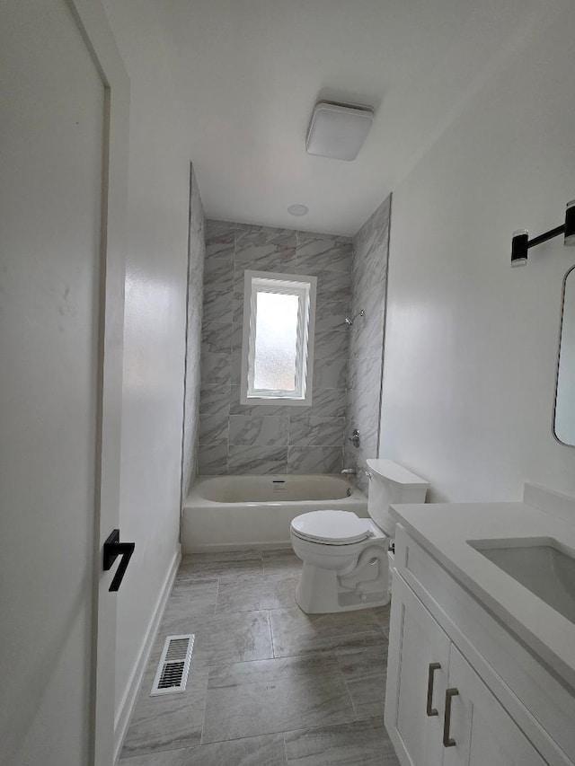 bathroom with shower / bathtub combination, toilet, vanity, visible vents, and baseboards