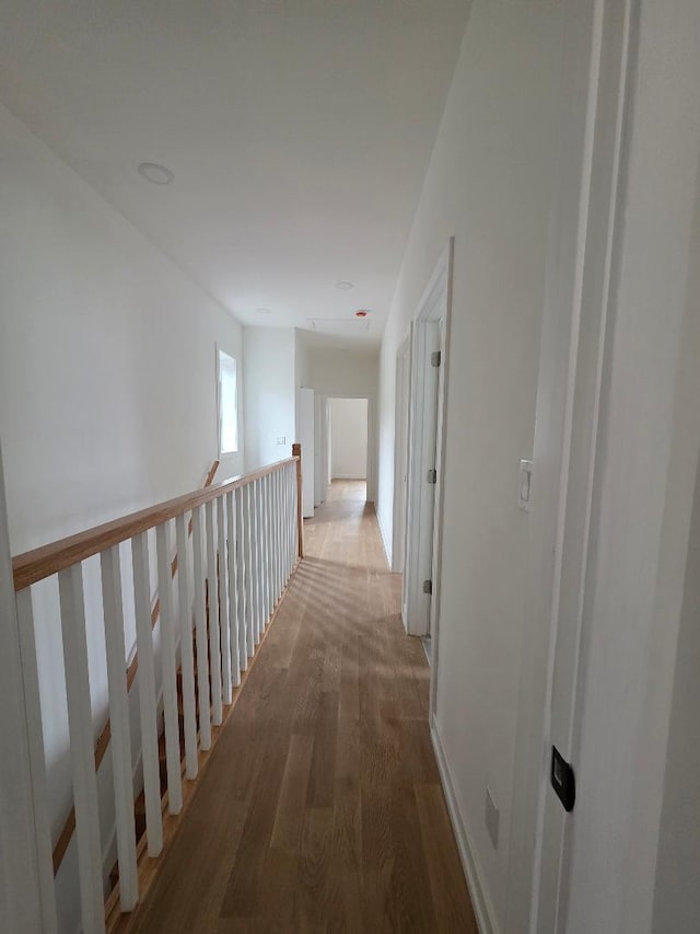 hallway with wood finished floors